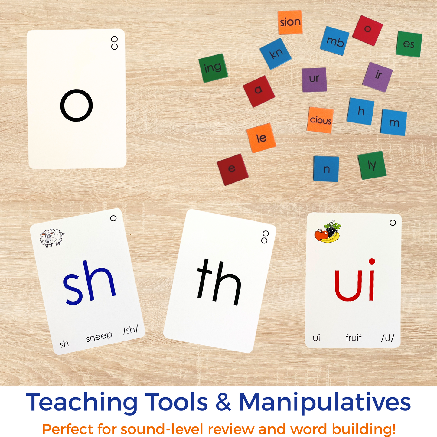 Educational cards with letters and sounds on a wooden surface, labeled 'Teaching Tools & Manipulatives'.